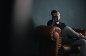 worried man on couch